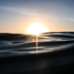 Photo of sunrise on water